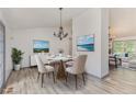 Well-lit dining room with contemporary chandelier and decor at 5406 Jamestowne Dr, Powder Springs, GA 30127