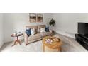 Cozy living room with neutral tones, plush seating, and stylish decor at 8032 Ridge Vly, Woodstock, GA 30189