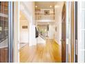 Bright foyer with hardwood floors, soaring ceilings, and an open staircase at 1059 Verbena Way, Auburn, GA 30011