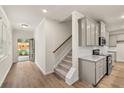 Open-concept kitchen with granite countertops, stainless steel appliances, and easy access to a beautiful pool at 1243 Riverstone Rd, Jonesboro, GA 30238
