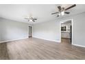 Spacious living room with new floors, ceiling fans, and an open layout perfect for entertaining and relaxation at 2078 Olive Springs Se Rd, Marietta, GA 30060