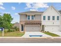 Charming townhome with brick and siding, pergola over garage, and well-manicured lawn at 4523 Moray Dr, Mableton, GA 30126