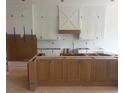 Unfinished kitchen features modern cabinetry and an island, ready for customization at 1089 Mount Carmel Church Ln, Canton, GA 30114