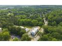 Aerial view of modern townhomes nestled within a lush green landscape and trees at 2150 Tidwell Ln # 5, Atlanta, GA 30318