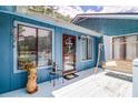 Inviting front porch with a swing and outdoor decor, creating a cozy entryway at 3739 Lake Carlton Rd, Loganville, GA 30052