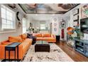 Bright living room with hardwood floors and a view into the kitchen at 569 Woods Nw Dr, Atlanta, GA 30318