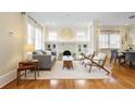 Bright living room featuring hardwood floors, fireplace, and decorative built-in shelving at 101 Terrace Dr, Atlanta, GA 30305