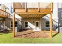 View of back patio and support columns for a wood deck at 2270 Siskin Square Rd # 91, Duluth, GA 30096