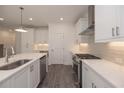 Modern white kitchen featuring stainless steel appliances at 2270 Siskin Square Rd # 91, Duluth, GA 30096