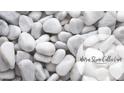 Close-up of warm stone collection showcasing smooth, round, white pebbles and elegant lettering at 2270 Siskin Square Rd # 91, Duluth, GA 30096