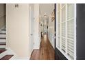 Inviting foyer features hardwood floors, wainscoting, and a door with glass panes letting in natural light at 2755 Greenbridge Dr, Norcross, GA 30071
