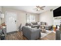 Comfortable living room featuring hardwood floors, a fireplace, and a cozy seating area at 1150 Bonita Cir, Jonesboro, GA 30238