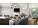 Inviting living room showcasing a fireplace, TV, and open layout to the kitchen and dining area at 1150 Bonita Cir, Jonesboro, GA 30238