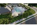 Aerial view of the community pool with lounge chairs, umbrellas, and landscaping at 6236 Kenbrook Dr, Tucker, GA 30084