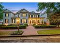 Charming home with a brick walkway, inviting front porch, and meticulously maintained landscaping at 8109 Lawnview, Alpharetta, GA 30022
