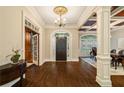 Elegant foyer featuring hardwood floors, grand archways, a decorative ceiling medallion and natural light at 8109 Lawnview, Alpharetta, GA 30022