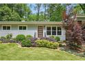 Inviting home featuring a stylish front door, manicured landscaping, and freshly painted exterior at 3018 Monterey Dr, Decatur, GA 30032