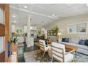 Open-concept living space featuring a modern kitchen, dining area, and sun-filled living room at 3018 Monterey Dr, Decatur, GA 30032
