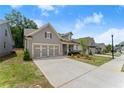 A beautiful single-story home showcasing a well-maintained lawn and inviting curb appeal at 207 Hickory Bluffs Pkwy, Canton, GA 30114