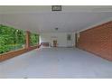 Spacious carport with brick accents, providing ample covered parking and storage at 1125 Lanier Sw Dr, Marietta, GA 30060