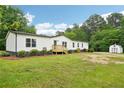 Attractive single-story home with white siding, landscaping, and detached shed at 1960 W Hightower Trl, Conyers, GA 30012
