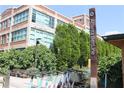 Exterior view of the Atlanta BeltLine with modern scooters, lush greenery, and architectural building in the background at 890 Memorial Se Dr # 102, Atlanta, GA 30316