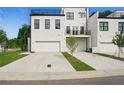 New construction townhome exterior showing garages and multiple levels at 2200 Carlton Ct # 6, Atlanta, GA 30318