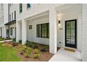 Beautiful white painted brick exterior with black trimmed windows and modern design elements at 2200 Carlton Ct # 6, Atlanta, GA 30318