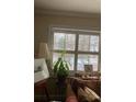 Bright living room featuring a cozy couch and large window with shutters at 2477 N Decatur Rd # A1, Decatur, GA 30033