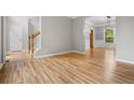 Bright and airy living room featuring gleaming hardwood floors and fresh paint, creating a welcoming atmosphere at 7035 Hampton Bluff Way, Roswell, GA 30075