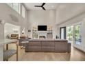 An expansive living room with vaulted ceilings, a cozy fireplace, and natural light at 1420 Cortez Ne Ln, Atlanta, GA 30319
