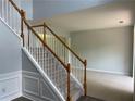 Bright foyer with a staircase, light gray walls, and beige carpeting at 3118 Stanstead Ct, Norcross, GA 30071