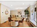 Bright living room featuring hardwood floors, modern decor, and ample natural light at 7249 Village Creek Trce, Atlanta, GA 30328