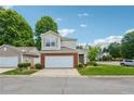 Two-story home with attached garage, neat landscaping, and a well-maintained lawn at 109 Windcroft Nw Cir, Acworth, GA 30101