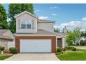 Two-story home featuring a brick-accented facade, attached garage, and a well-maintained front yard at 109 Windcroft Nw Cir, Acworth, GA 30101
