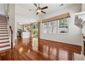 Bright living room featuring hardwood floors, fireplace, open to kitchen and sliding glass doors to back at 109 Windcroft Nw Cir, Acworth, GA 30101