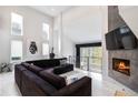 Spacious living room boasting a high ceiling, fireplace, and ample natural light at 4 Vale Close Ne Ct, Atlanta, GA 30324