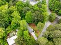 Home with pool surrounded by mature trees, showing a private backyard oasis at 504 Kingswood Nw Ln, Atlanta, GA 30305