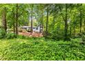 Secluded home nestled in lush greenery, offering privacy and a serene setting at 504 Kingswood Nw Ln, Atlanta, GA 30305