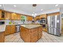 Spacious kitchen with an island, stainless steel appliances, and light wood cabinetry at 1690 Cedar Grove Dr, Marietta, GA 30066