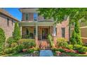 Beautiful brick home with a welcoming front porch and manicured lawn at 2043 Mason Mill Rd, Decatur, GA 30033