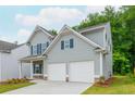 Charming two-story home with a well-manicured lawn and an attached two car garage at 174 Bloomfield Cir, Canton, GA 30114