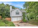 Charming split-level home with a two-car garage and freshly painted siding at 3694 Arrowhead Pl, Douglasville, GA 30135