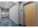 Hallway with patterned carpet and modern lighting leading to unit 1712 at 860 Peachtree Ne St # 1712, Atlanta, GA 30308