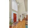 Elegant foyer with hardwood floors, high ceilings, and a view of the dining room at 222 Mossy Pl, Alpharetta, GA 30005