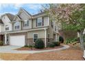 Beautiful home exterior featuring brick accents, landscaping, and a sidewalk at 331 Franklin Ln, Acworth, GA 30102