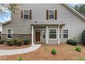 Charming home exterior featuring a warm color palette and well maintained shrubbery at 331 Franklin Ln, Acworth, GA 30102