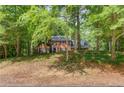 Traditional brick home with a mature treed front yard offering curb appeal and charm at 3741 Windhurst Dr, Lilburn, GA 30047