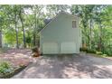Two car garage and long driveway, offering convenience and plenty of parking space at 3741 Windhurst Dr, Lilburn, GA 30047