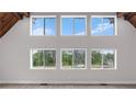Bright living room with large windows and stunning views of nature at 4131 West Village Pkwy, Ellenwood, GA 30294